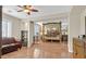 Spacious bedroom with a four-poster bed, hardwood floors, and comfortable seating area at 10001 Blairwood Ct, Las Vegas, NV 89178
