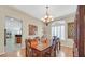 Bright dining room with hardwood floors and a stylish chandelier at 10001 Blairwood Ct, Las Vegas, NV 89178
