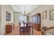 Formal dining room with a chandelier, hardwood floors, and elegant furnishings at 10001 Blairwood Ct, Las Vegas, NV 89178