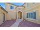 Stunning front entrance featuring a brick walkway and arched doorway at 10001 Blairwood Ct, Las Vegas, NV 89178