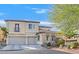 Beautiful two-story home with a two-car garage and well-maintained landscaping at 10001 Blairwood Ct, Las Vegas, NV 89178