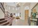 Elegant foyer with a grand staircase, high ceilings, and stylish decor at 10001 Blairwood Ct, Las Vegas, NV 89178