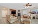 Bright living room with fireplace, built-in entertainment center, and comfortable seating at 10001 Blairwood Ct, Las Vegas, NV 89178