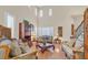 Open-concept living room with high ceilings, hardwood floors, and lots of light at 10001 Blairwood Ct, Las Vegas, NV 89178