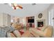 Cozy living room with fireplace, entertainment center, and comfortable couches at 10001 Blairwood Ct, Las Vegas, NV 89178