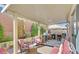 An outdoor covered patio features a kitchen, sitting area, and wall-mounted waterfall at 10001 Blairwood Ct, Las Vegas, NV 89178