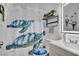 Bathroom with turtle-themed shower curtain and nice mirror at 1008 Welkin St, Henderson, NV 89052