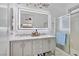 Modern bathroom with double sinks, sleek vanity, and glass-enclosed shower at 1008 Welkin St, Henderson, NV 89052