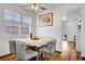 The dining room has wood floors, a ceiling fan, and a large window at 1008 Welkin St, Henderson, NV 89052