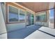 Covered patio with multiple windows providing ample natural light, enhancing the outdoor living space at 10184 Juniper Valley St, Las Vegas, NV 89166