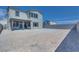 Spacious backyard with a covered patio, enclosed by a block wall, and awaits landscaping to become an oasis at 10184 Juniper Valley St, Las Vegas, NV 89166