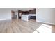 Spacious living room area leading into the kitchen with a white island at 10184 Juniper Valley St, Las Vegas, NV 89166
