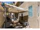 Outdoor area featuring a grill, table and chairs, and some outdoor decor at 10583 Mann St, Las Vegas, NV 89141