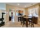 Dining area with a table set for four, providing a welcoming space for meals and gatherings at 10583 Mann St, Las Vegas, NV 89141