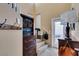 Hallway has desk area, shelving and coat hooks at 10583 Mann St, Las Vegas, NV 89141