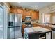 The kitchen features stainless steel appliances and wood cabinets at 10583 Mann St, Las Vegas, NV 89141
