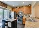 Functional kitchen featuring stainless steel appliances, ample cabinetry, and a convenient center island at 10583 Mann St, Las Vegas, NV 89141
