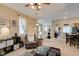 Open-concept living area with living room, kitchen, and dining area provides space for Gathering and entertaining at 10583 Mann St, Las Vegas, NV 89141