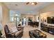 The open floor plan connects the living space to the dining area for easy interaction and entertaining at 10583 Mann St, Las Vegas, NV 89141
