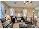 Inviting living room with a comfortable leather sofa set and a display unit for storage and decor at 10583 Mann St, Las Vegas, NV 89141