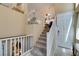 A bright stairwell leads to the home's entrance and features a large closet at 10583 Mann St, Las Vegas, NV 89141