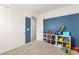 Second ' bedroom with toys on the floor, carpet, and white trim offers a fun retreat at 1075 Page Park Ln, Henderson, NV 89011