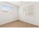 Bright, airy bedroom with wood-look flooring and window shutters at 1075 Page Park Ln, Henderson, NV 89011