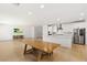 Open-concept living and dining area with lots of natural light at 1075 Page Park Ln, Henderson, NV 89011