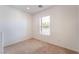 Bright, carpeted bedroom with a large window at 11749 Villa San Michele Ct, Las Vegas, NV 89138