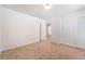Well-lit bedroom with neutral carpet, closet, and an open entryway at 11749 Villa San Michele Ct, Las Vegas, NV 89138