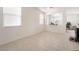 Inviting living room with tiled floors, bright natural light, and a glimpse into an adjoining workspace at 11749 Villa San Michele Ct, Las Vegas, NV 89138