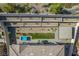 Aerial view of home with backyard, covered patio, landscaping, outdoor kitchen and pool at 12332 Switchgrass Ave, Las Vegas, NV 89138