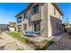 Large two-story house with a backyard featuring covered patio, bbq, and seating at 12332 Switchgrass Ave, Las Vegas, NV 89138