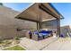 Backyard with patio seating area and custom designed pergola at 12332 Switchgrass Ave, Las Vegas, NV 89138