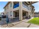 Large backyard featuring a covered patio, dining area, grill and a lush lawn at 12332 Switchgrass Ave, Las Vegas, NV 89138