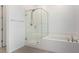 Bathroom featuring a glass enclosed shower with tub at 12332 Switchgrass Ave, Las Vegas, NV 89138