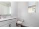 Bright bathroom with double vanity, framed mirror, and sleek fixtures at 12332 Switchgrass Ave, Las Vegas, NV 89138