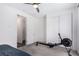 Bedroom with neutral walls, ceiling fan, closet, and ensuite bathroom at 12332 Switchgrass Ave, Las Vegas, NV 89138