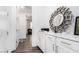 Hallway features white cabinets with countertops and a decorative mirror at 12332 Switchgrass Ave, Las Vegas, NV 89138