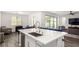 Kitchen features a large island with seating, modern appliances, and an open layout at 12332 Switchgrass Ave, Las Vegas, NV 89138