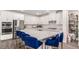 Bright kitchen with white cabinets, a large center island, and stainless steel appliances at 12332 Switchgrass Ave, Las Vegas, NV 89138