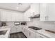 Well-appointed kitchen with white cabinetry, a subway tile backsplash, and stainless steel appliances at 12332 Switchgrass Ave, Las Vegas, NV 89138