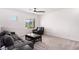 Spacious living room with plush carpeting, modern gray sofa and stylish decor at 12332 Switchgrass Ave, Las Vegas, NV 89138