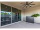 Covered patio with ceiling fan and large sliding glass doors at 12332 Switchgrass Ave, Las Vegas, NV 89138