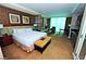 This bedroom features a plush bed, sitting area, and window with curtains and a partial kitchenette at 125 E Harmon Ave # 1918, Las Vegas, NV 89109
