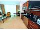 This kitchenette features a sink, microwave, and coffee maker with natural light shining through the window at 125 E Harmon Ave # 1918, Las Vegas, NV 89109