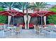Inviting outdoor dining area features patio tables, comfortable seating, and shade umbrellas at 125 E Harmon Ave # 1918, Las Vegas, NV 89109