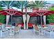 Inviting outdoor dining area features patio tables, comfortable seating, and shade umbrellas at 125 E Harmon Ave # 1918, Las Vegas, NV 89109