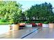 Comfortable outdoor lounge area features plush seating, mature trees, and beautiful greenery at 125 E Harmon Ave # 1918, Las Vegas, NV 89109