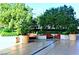 Comfortable outdoor lounge area features plush seating, mature trees, and beautiful greenery at 125 E Harmon Ave # 1918, Las Vegas, NV 89109